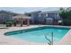 Community pool features a covered patio area with lounge seating and clear blue water at 2301 E University Dr # 269, Mesa, AZ 85213