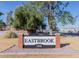 The Eastbrook community welcome sign is displayed on a brick and gravel base at 2301 E University Dr # 269, Mesa, AZ 85213