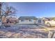Large backyard featuring a chain-link fence, bare tree, and access to a neighboring property at 2430 W Papago St, Phoenix, AZ 85009