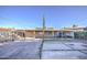 View of the backyard featuring a covered patio, concrete, and minimal landscaping at 2430 W Papago St, Phoenix, AZ 85009