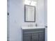Bathroom showcasing a gray vanity, white countertop and silver faucet at 2430 W Papago St, Phoenix, AZ 85009