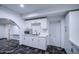 A well-lit room with white cabinets and a stylish black and white patterned floor at 2430 W Papago St, Phoenix, AZ 85009