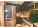 Stainless steel refrigerator and oven in kitchen at 2533 N 114Th Ave, Avondale, AZ 85392
