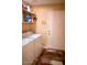 A clean laundry area with washer, dryer, shelving, and access door for convenience at 2533 N 114Th Ave, Avondale, AZ 85392