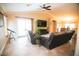 Bright living room with tile floors and access to dining and outdoor spaces at 2533 N 114Th Ave, Avondale, AZ 85392