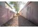 A low-maintenance side yard provides privacy and a clean, simple design at 2533 N 114Th Ave, Avondale, AZ 85392