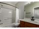 Well-lit bathroom featuring a shower and bath, toilet and wood-look vanity at 2918 E Silverbell Rd, San Tan Valley, AZ 85143