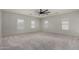 Spacious main bedroom offers neutral paint, carpet, and natural light from large window at 2918 E Silverbell Rd, San Tan Valley, AZ 85143