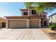 Inviting two-story home with a spacious three-car garage and well-maintained landscaping at 2918 E Silverbell Rd, San Tan Valley, AZ 85143