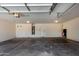 The spacious garage is equipped with overhead lighting at 2918 E Silverbell Rd, San Tan Valley, AZ 85143