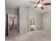 Main bedroom featuring neutral carpet, ceiling fan, and ensuite bath with tub and shower at 2918 E Silverbell Rd, San Tan Valley, AZ 85143