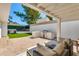 Inviting back patio features built-in grill, comfortable seating, and pavers at 3038 E Stella Ln, Phoenix, AZ 85016