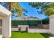 Lush backyard offers artificial turf, mountain views, and a calming water feature at 3038 E Stella Ln, Phoenix, AZ 85016
