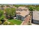 Aerial view of a well-maintained home with manicured lawn and a terracotta-colored roof at 3042 N Beverly Pl, Buckeye, AZ 85396