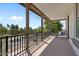 Relaxing covered balcony with seating and a beautiful neighborhood view at 3042 N Beverly Pl, Buckeye, AZ 85396