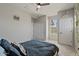 Bright bedroom featuring closet, ceiling fan, and modern decor at 3042 N Beverly Pl, Buckeye, AZ 85396
