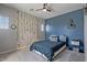 Stylish bedroom with a mix of grey and blue tones, decorative lighting, and modern accents at 3042 N Beverly Pl, Buckeye, AZ 85396