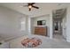 Spacious bedroom with ceiling fan, dresser, and a neutral color palette at 3042 N Beverly Pl, Buckeye, AZ 85396
