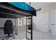 Bedroom features a lofted bed with a desk underneath it, and a closet with sliding doors at 3042 N Beverly Pl, Buckeye, AZ 85396