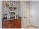 Charming coffee station with decorative wallpaper and storage, perfect for beverage enthusiasts at 3042 N Beverly Pl, Buckeye, AZ 85396