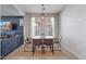 Modern dining area with a large table, seating for four, and stylish decor at 3042 N Beverly Pl, Buckeye, AZ 85396