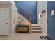Inviting entryway with staircase, decor and stylish lighting, adding character to the home at 3042 N Beverly Pl, Buckeye, AZ 85396
