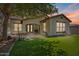 Attractive home with a covered patio, neat landscaping, and spacious backyard perfect for relaxing and entertaining at 3042 N Beverly Pl, Buckeye, AZ 85396