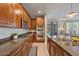 Well-appointed kitchen with stainless steel appliances, granite countertops, and ample natural light at 3042 N Beverly Pl, Buckeye, AZ 85396