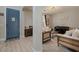 Bright living room with modern decor, hardwood floors, and cozy seating arrangements at 3042 N Beverly Pl, Buckeye, AZ 85396