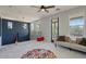 Cozy upstairs loft with comfortable seating, stylish decor, and plenty of natural light at 3042 N Beverly Pl, Buckeye, AZ 85396