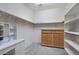 Large walk-in closet with vanity, built-in shelving, and plenty of storage space at 3042 N Beverly Pl, Buckeye, AZ 85396