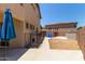 View of home backyard with dog run, patio, and lush plants at 3177 S Sierra St, Gilbert, AZ 85295