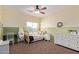 Bright bedroom featuring one bed, neutral color paint, and a large window with views at 3177 S Sierra St, Gilbert, AZ 85295