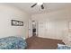 Bright bedroom featuring two twin beds, neutral color paint, and a sliding door closet at 3177 S Sierra St, Gilbert, AZ 85295