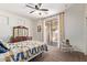 Well-lit bedroom featuring a ceiling fan, a hanging chair and a bed facing the sliding glass door at 3177 S Sierra St, Gilbert, AZ 85295