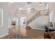 Grand foyer boasts soaring ceilings, tile flooring, and a beautiful staircase at 3177 S Sierra St, Gilbert, AZ 85295