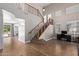 Welcoming foyer features a winding staircase, tile flooring, and soaring ceilings at 3177 S Sierra St, Gilbert, AZ 85295
