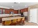 Stylish kitchen featuring a granite island with seating, stainless steel appliances and custom cabinetry at 3177 S Sierra St, Gilbert, AZ 85295
