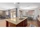 Open concept kitchen with granite island, stainless steel appliances, and adjacent dining area at 3177 S Sierra St, Gilbert, AZ 85295