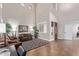 Bright, airy living room with high ceilings, plantation shutters, and comfortable sofa seating at 3177 S Sierra St, Gilbert, AZ 85295