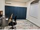 Home office with built-in storage and desk with stylish modern decor and natural light at 3177 S Sierra St, Gilbert, AZ 85295