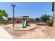 Outdoor playground featuring a swing set, slide, and a trampoline for Gathering fun at 3177 S Sierra St, Gilbert, AZ 85295