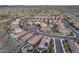 Aerial view of the neighborhood showcases well-maintained homes with private pools and lush desert landscaping at 32359 N 129Th Dr, Peoria, AZ 85383