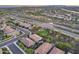 Aerial view of a neighborhood with a green space, community park at 32359 N 129Th Dr, Peoria, AZ 85383