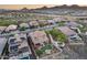 Aerial view of desert homes, pool, firepit, and landscaping near mountains at 32359 N 129Th Dr, Peoria, AZ 85383