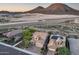 Aerial view of desert homes showcasing tiled roofs and community landscaping near natural desert landscape at 32359 N 129Th Dr, Peoria, AZ 85383