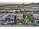 Aerial view of desert homes with solar panels, pool, fire pit, and landscaping at 32359 N 129Th Dr, Peoria, AZ 85383