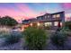 The home's exterior features a cozy patio and outdoor kitchen at 32359 N 129Th Dr, Peoria, AZ 85383