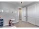 This cozy bedroom offers neutral colors and ample closet storage and access to the hallway at 32359 N 129Th Dr, Peoria, AZ 85383