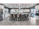 Modern kitchen features a large island with seating and views to the backyard at 32359 N 129Th Dr, Peoria, AZ 85383